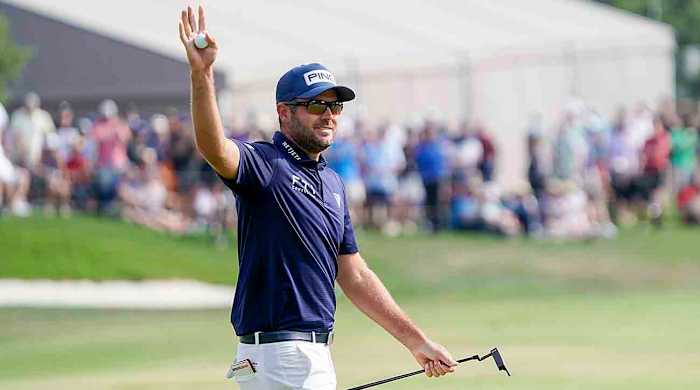 Corey Conners acknowledges the crowd after winning the 2023 Valero Texas Open.